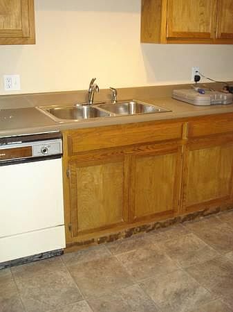 Kitchen with new fridge, gas stove