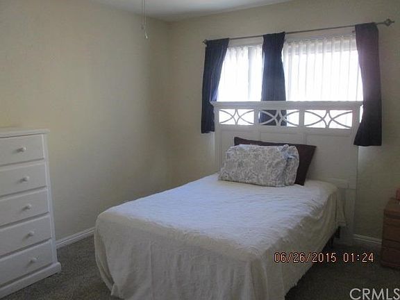 Master bedroom with carpet.