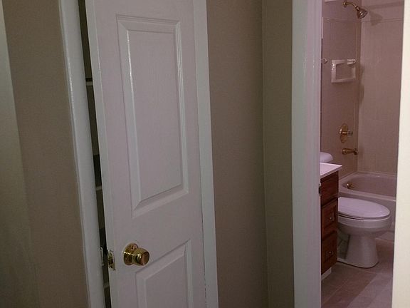 Linen Closet with view into Bathroom