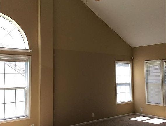 Living/dining room with cathedral ceilings.