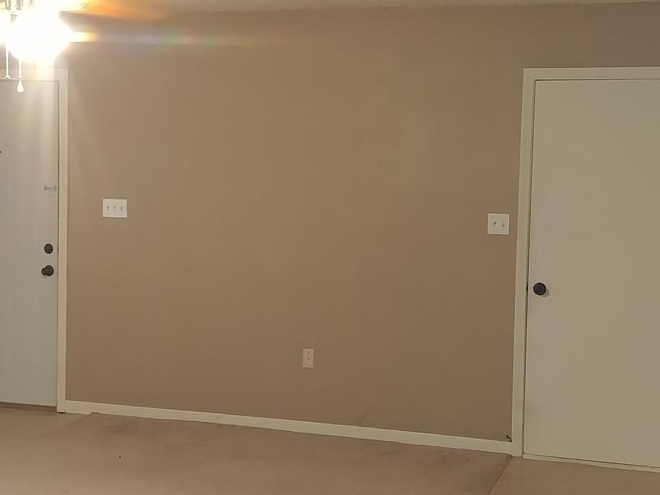 Living room, entry to house & garage.