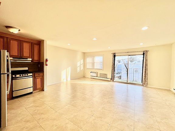 Kitchen, Living, and Dining Area View from Entry