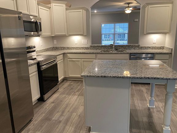 Kitchen with pass through archway to family room