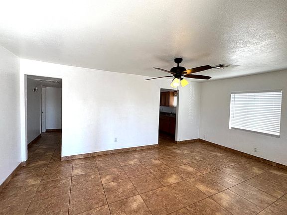 Living room with ceiling fan.