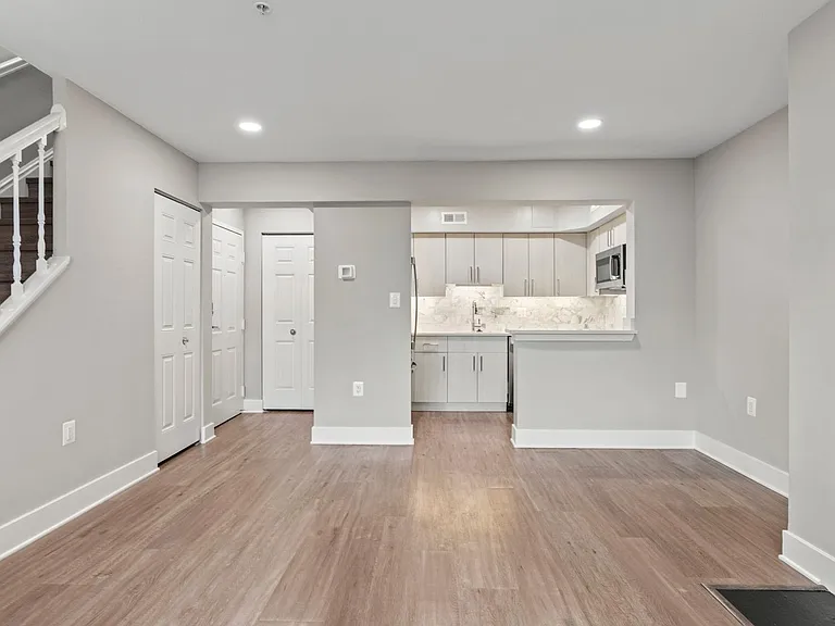 Towne=home floor plan features a spacious living and dining area, storage, and open concept kitchen