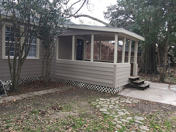 Large fenced yard with porch