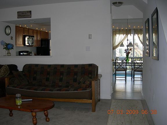 Living room, kitchen, half bath, and deck on 1st floor.