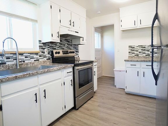 New Countertops, new Sink, New Floor, Stainless steel stove, refrigerator, and dishwasher.
