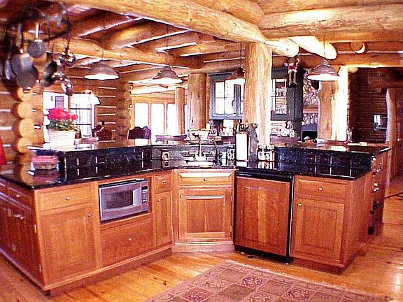 Gourmet Island Kitchen w/comm. appliances, hand crafted cheery cab. & granite