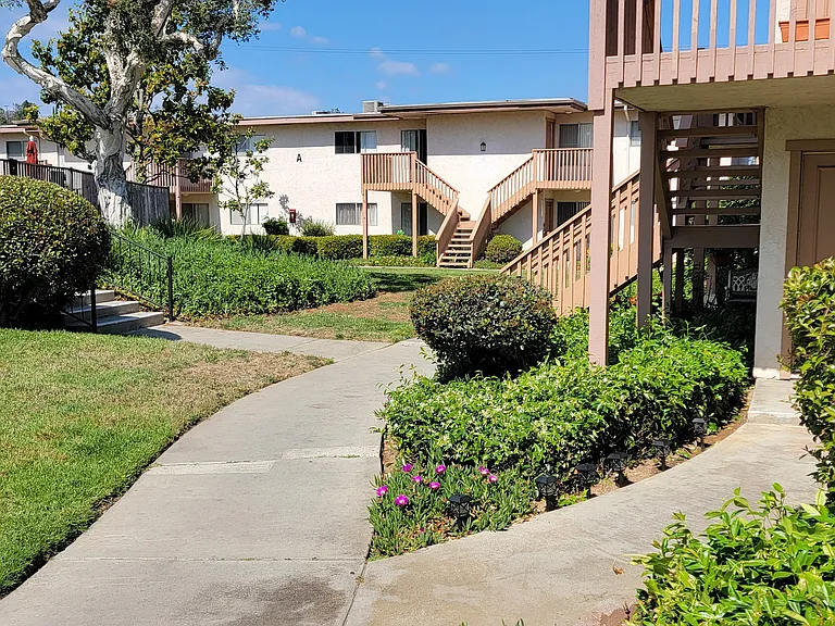 Gardens around apartment enterences at Plaza Verde Apartments in Escondido, California.