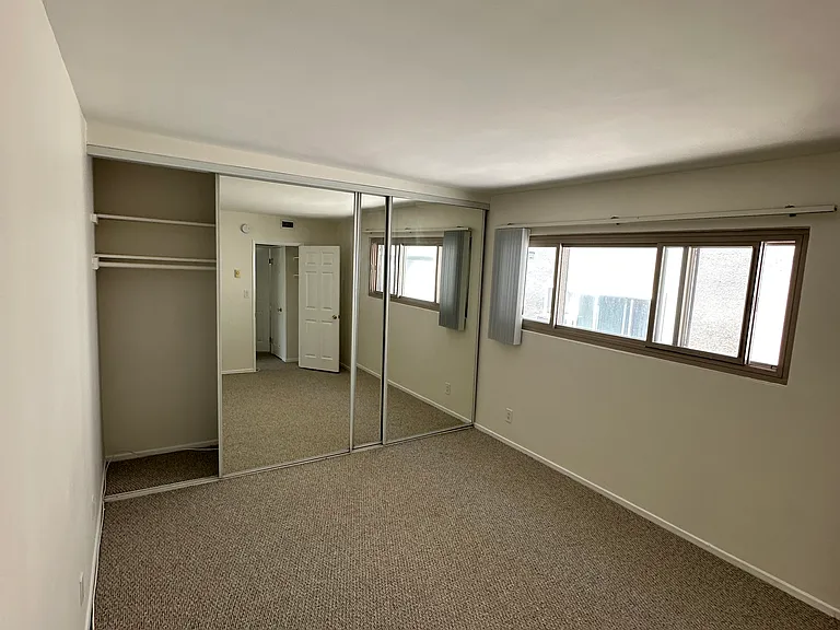 Bedroom with triple-wide closet
