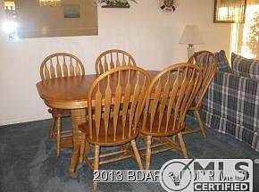 Table has 2 leaves & 8 chairs!