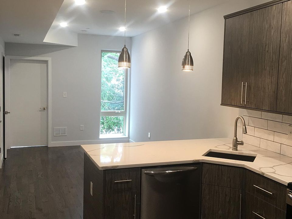 Kitchen and living room with tons of natural light.
