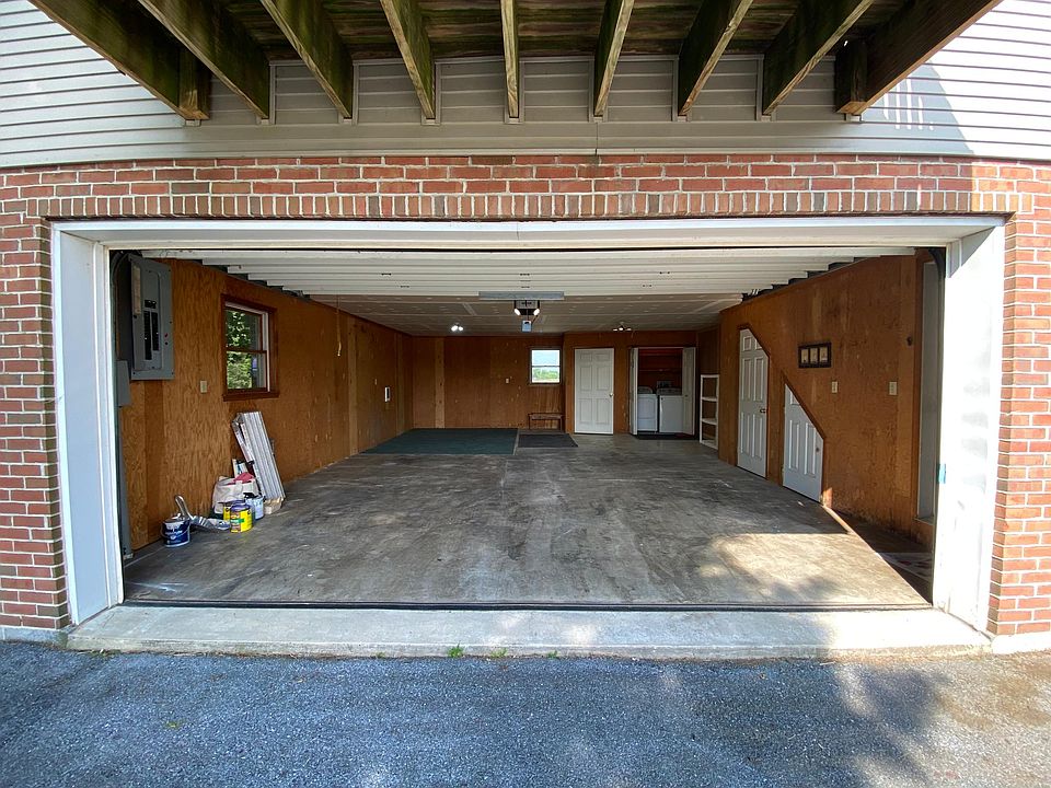 2 car garage with 4 closets and laundry closet and interior entrance to apartment.