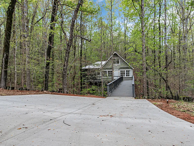 Parking pad before boardwalk of home