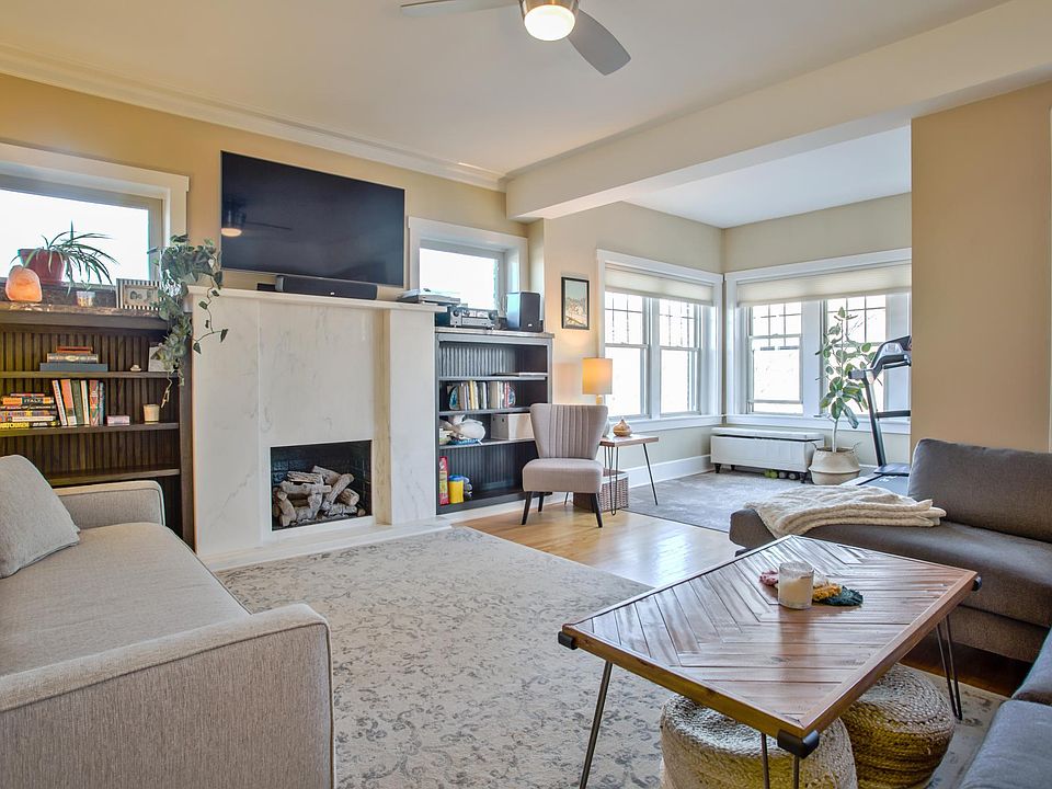 Living room with partial view of sunroom.
