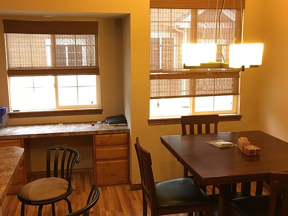 Dining area - kitchen/bar to the left (photo is from when furnished)