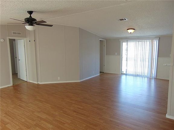Living room towards formal dining and master bedroom