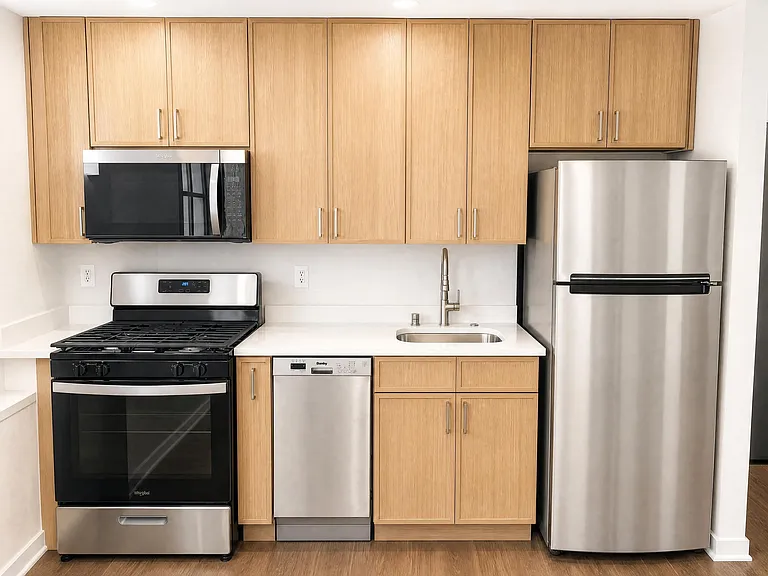 Newly redesigned kitchen featuring modern cabinetry, stainless steel appliances, and sleek countertops.