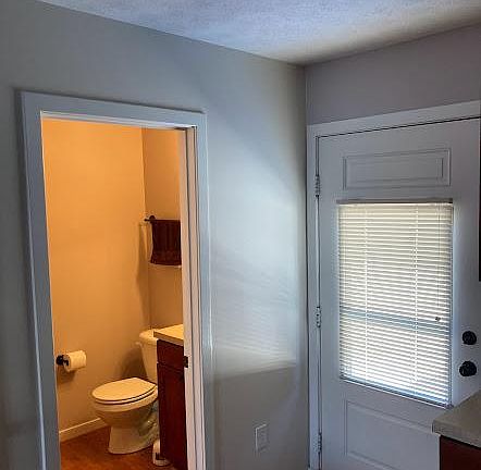 Half bath. Door leads to back deck and yard
