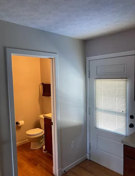 Half bath. Door leads to back deck and yard