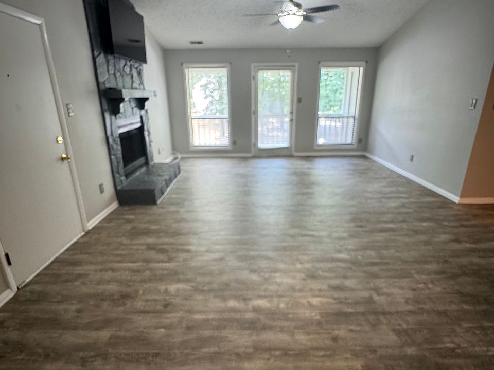 Family room with fireplace and television mounted above