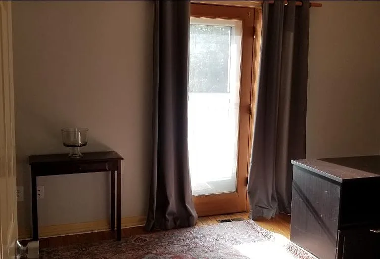 Office area showing door to outside 2nd floor deck and back yard, printer stand with two wide file drawers beneath.