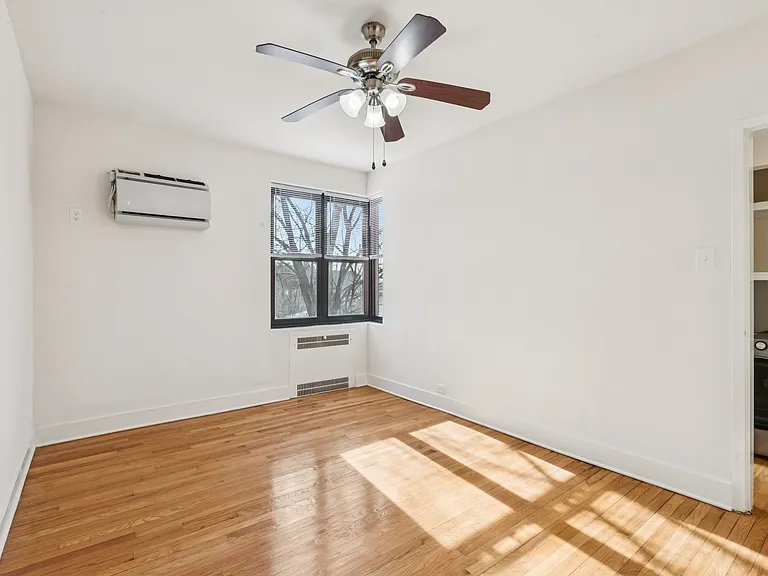 Primary Bedroom with built-in wall A/C unit