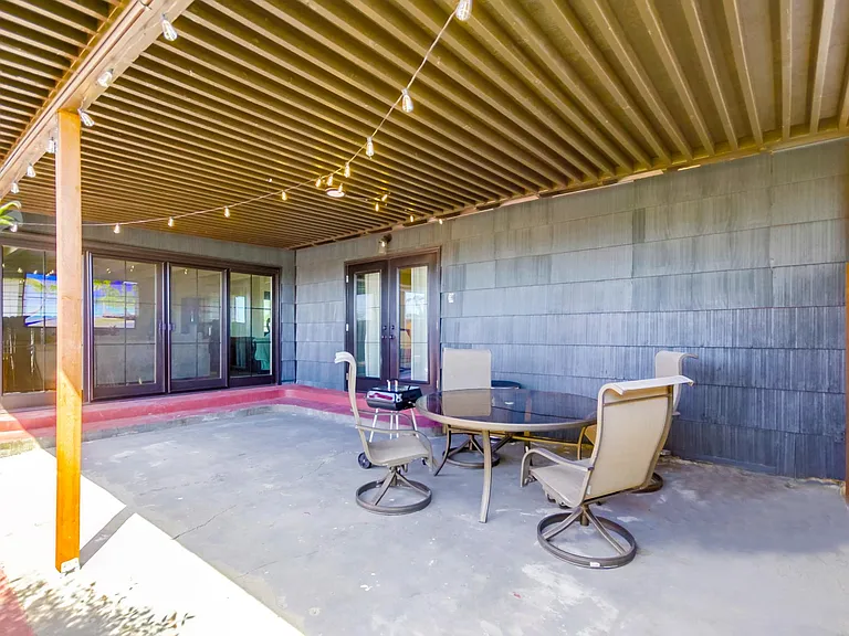 This spacious outdoor lounge is perfect for sunny get-togethers or evening BBQs