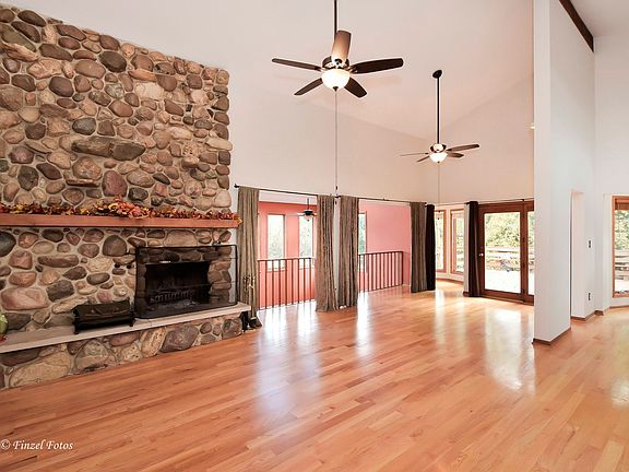 Family Room with Stone Fire Place - Open to Dining Rm and Kitchen