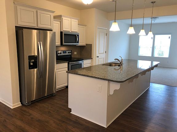 Bright and airy kitchen with huge granite island