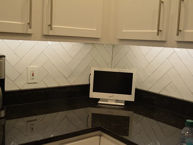 Select units have backsplashes and under cabinet & over cabinet lighting