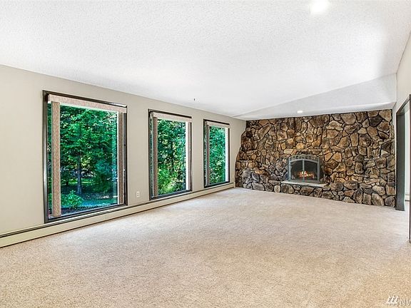 Huge living room with vaulted ceilings and large windows for tons of natural light.