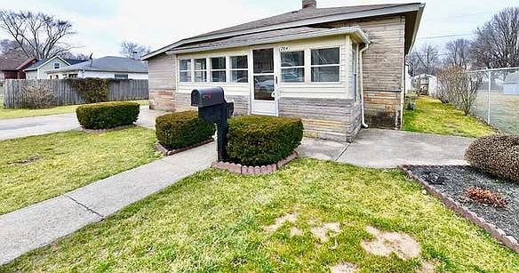 Fenced-in yard, with a gate to the spacious driveway.