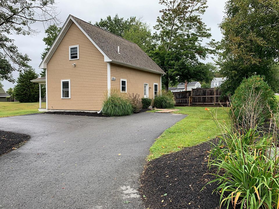 Front view of home with parking area.