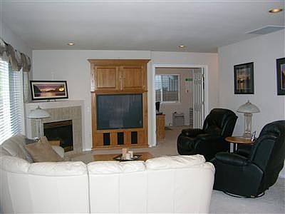 Family room off of kitchen with built in media center.