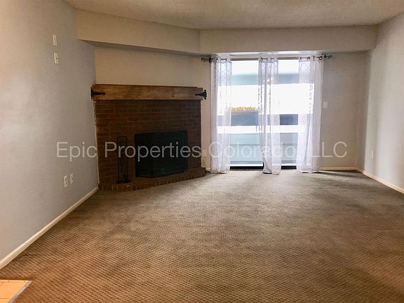 Living Room with Fireplace and Balcony access