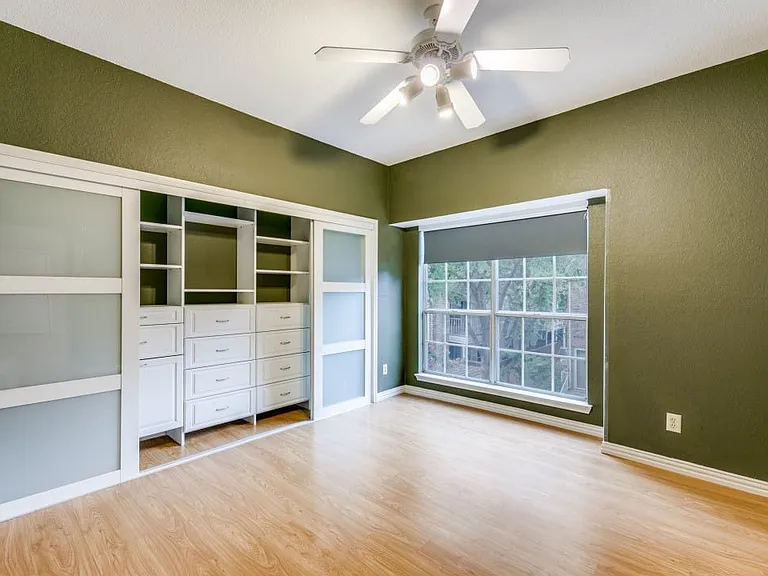 Custom closet system in master bedroom.