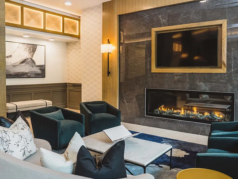 Expansive clubroom with a sleek fireplace