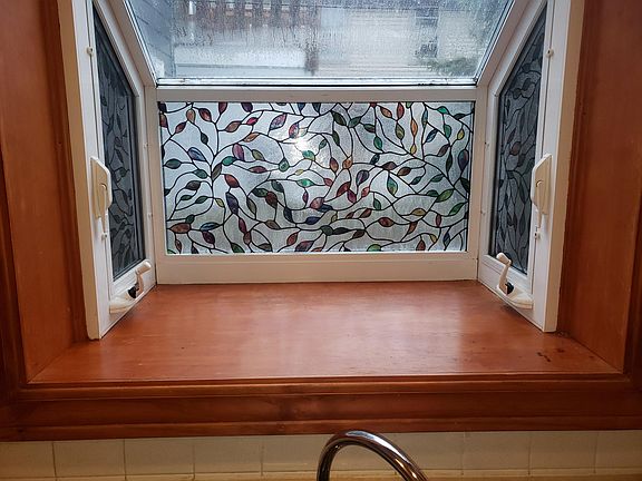 Kitchen includes "Over-The-Range" Microwave, oven, refrigerator with icemaker, & dishwasher. Also includes two bay windows, solid surface wink, and LED lighting. Also includes vinyl plank flooring, tile backsplash, & crown molding.