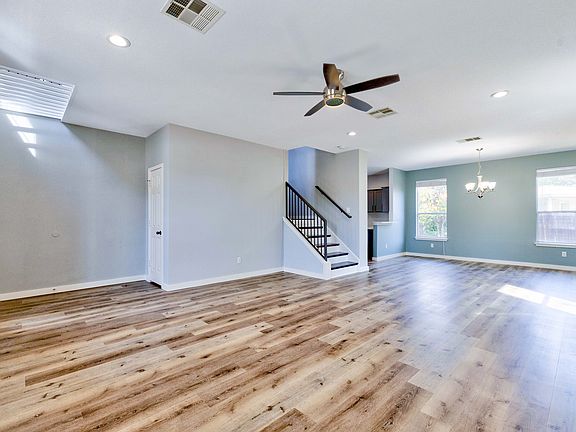 Spacious and welcoming living room and dining area, with brand new white Oak flooring.