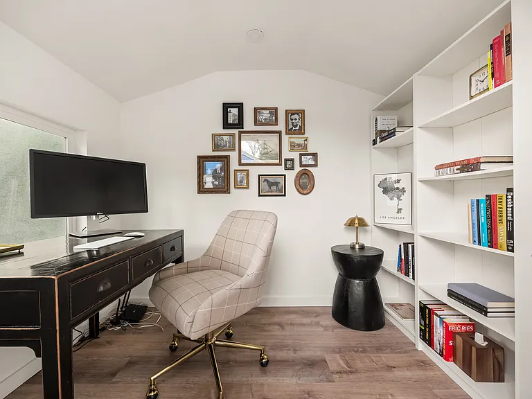 Separate office with a dedicated workspace, monitor, and high-speed Ethernet-connected internet.