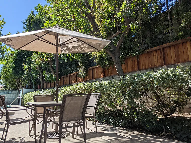 Relaxing garden patio near pool