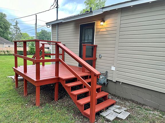 Deck with side entrance to home.