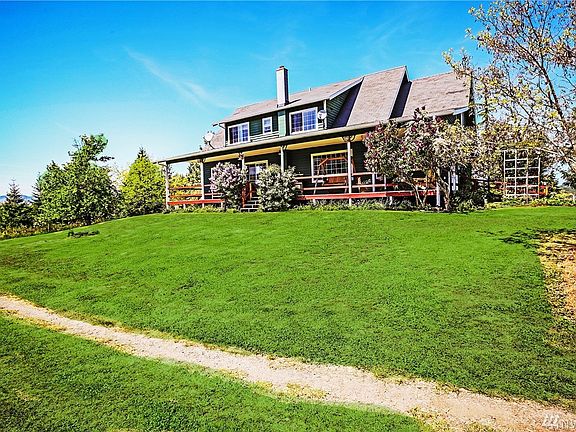 Soak in the tranquility as you look over your land from your covered back porch.  