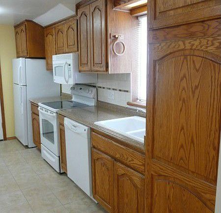 Kitchen has new countertops and backsplash, new dishwasher, range, microwave and refrigerator