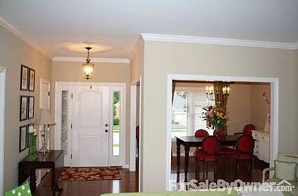 Dining Room and Foyer
						:
						This is the view of the dining room and foyer from the living room.