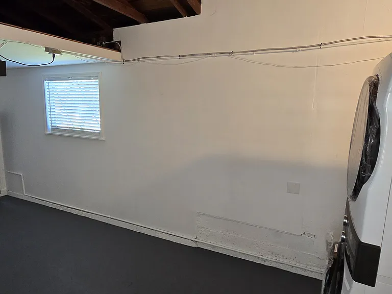 Clean, open layout perfect for home gym, storage, or small car.