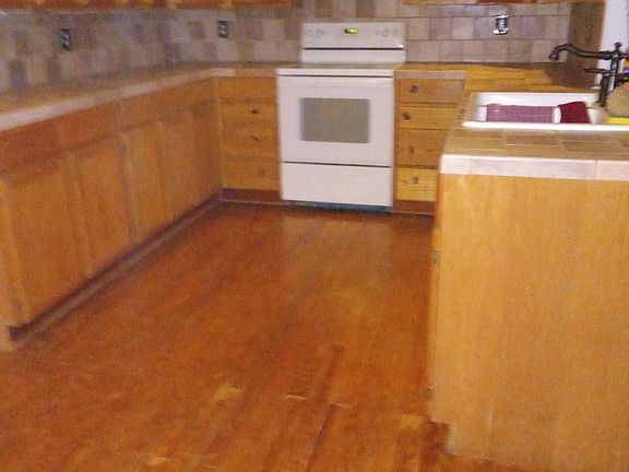 Kitchen before the current tenant who is being evicted moved in.