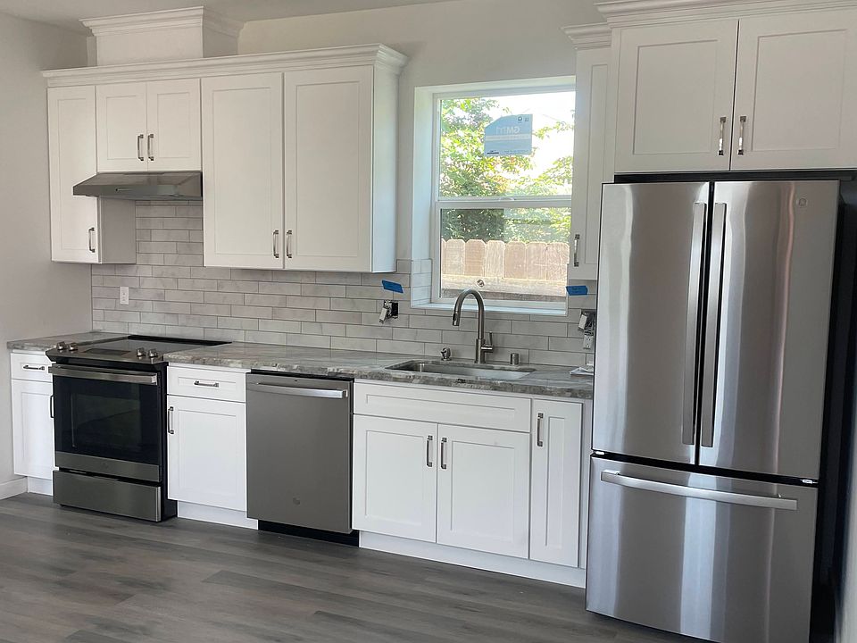 Full kitchen appliances with oversized window for tons of natural light